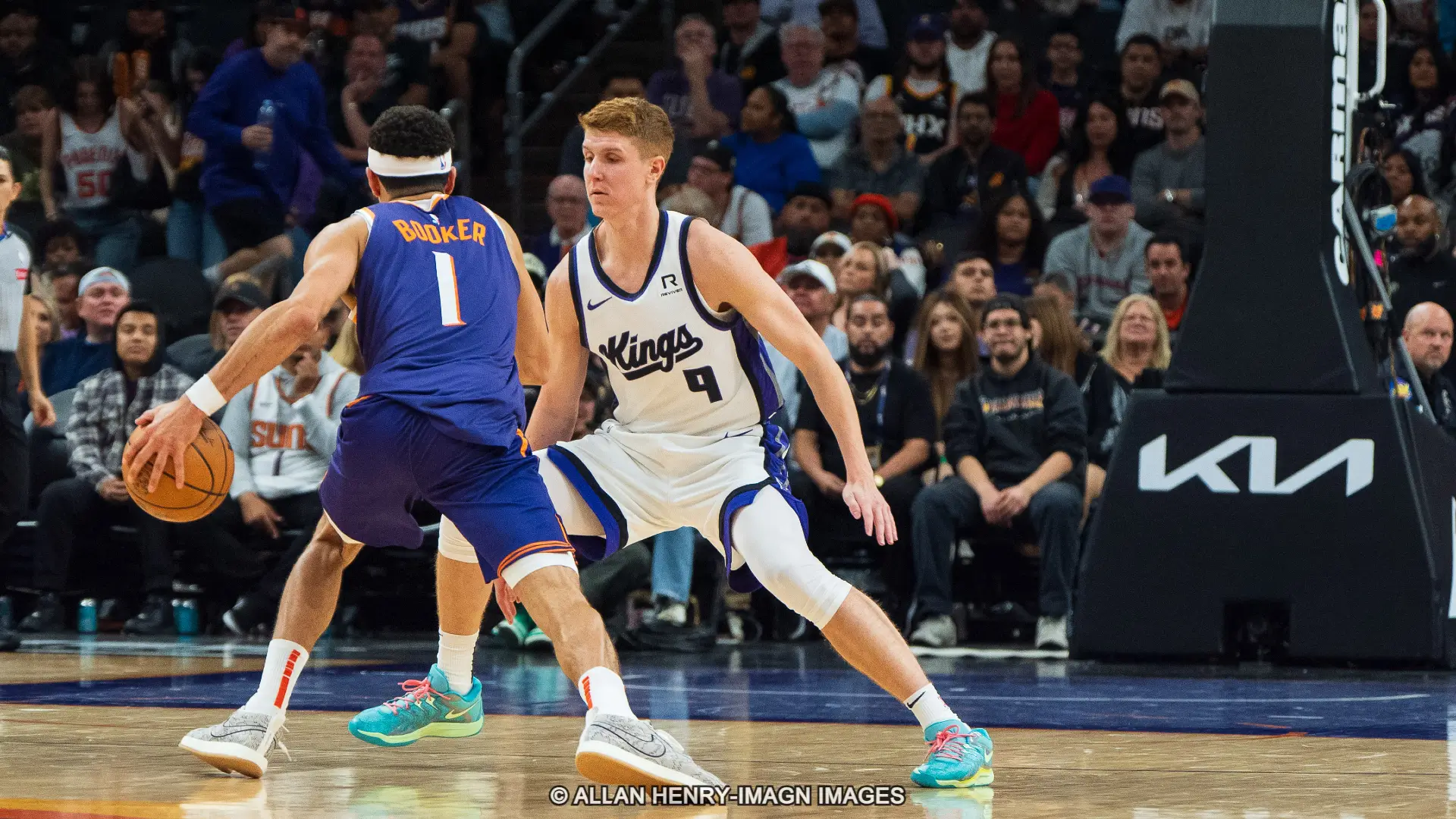 Suns vs. Kings Odds Phoenix Suns guard Devin Booker (1) drives against Sacramento Kings guard-forward Kevin Huerter (9)