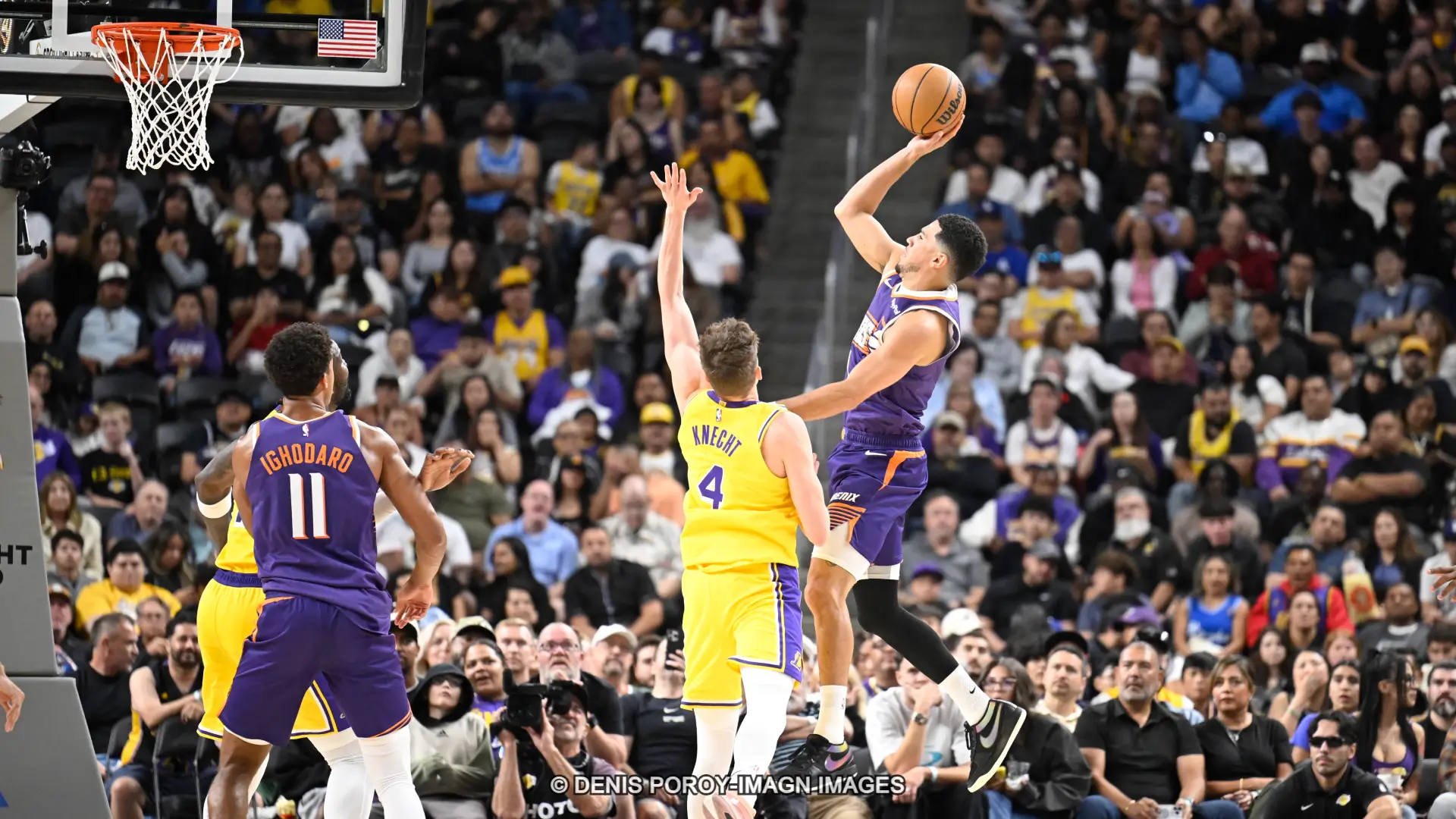 Phoenix Suns guard Devin Booker shoots a jumper.