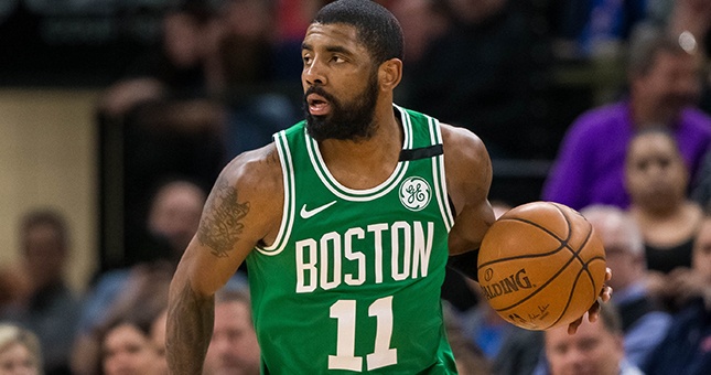 Boston Celtics guard Kyrie Irving (11) dribbles in the third quarter against Minnesota Timberwolves at Target Center.