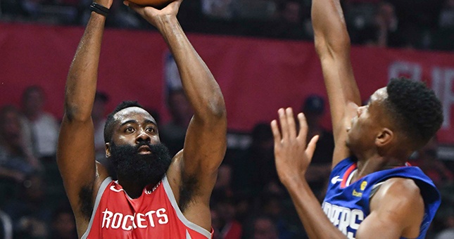 Houston Rockets guard James Harden (13) shoots a jump shot over LA Clippers guard Shai Gilgeous-Alexander (2) during the second quarter at Staples Center. Mandatory