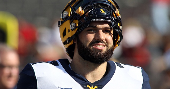West Virginia Mountaineers quarterback Will Grier (7) before the game against the Texas Tech Red Raiders at Jones AT&T Stadium.