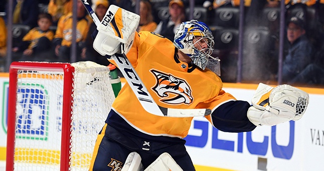 Nashville Predators goaltender Juuse Saros (74) catches the puck to the side of his net during the second period against the Vegas Golden Knights at Bridgestone Arena.