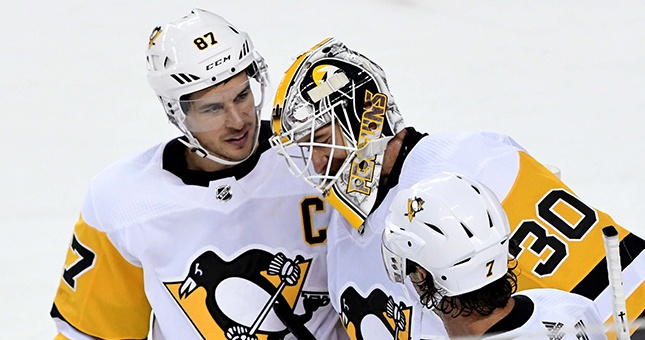 Pittsburgh Penguins center Sidney Crosby (87) congratulates goalie Matt Murray (30) after defeating the Calgary Flames at Scotiabank Saddledome.