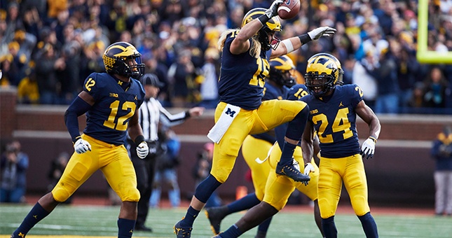 Michigan Wolverines defensive lineman Chase Winovich (15) celebrates after he recovers a fumble in the first half against the Penn State Nittany Lions at Michigan Stadium.