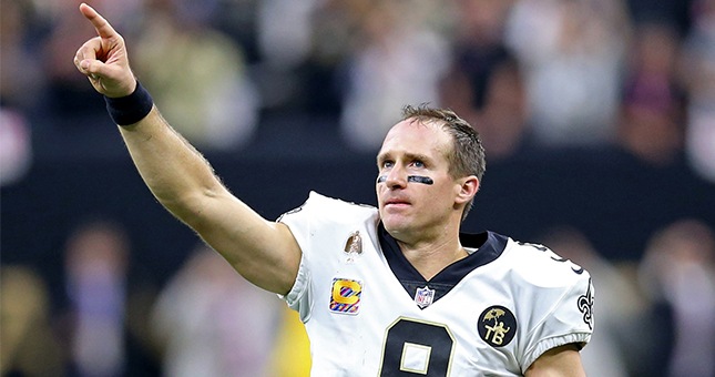 New Orleans Saints quarterback Drew Brees (9) acknowledges the crowd after setting the all-time NFL passing yardage mark against the Washington Redskins in the second quarter at the Mercedes-Benz Superdome.