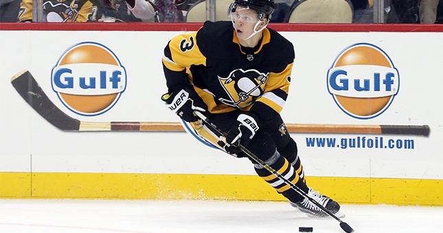 Pittsburgh Penguins defenseman Olli Maatta (3) handles the puck against the Toronto Maple Leafs during the second period at PPG PAINTS Arena.
