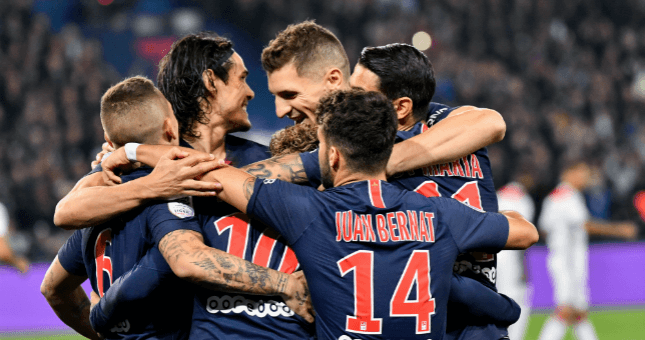 PSG celebrate scoring against Olympique Lyonnais.