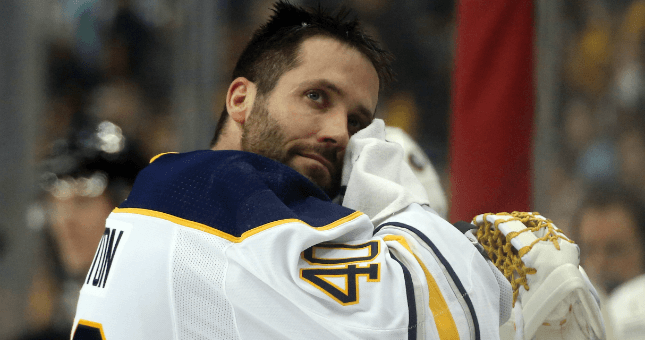 Buffalo Sabres goaltender Carter Hutton (40) wipes his face during a timeout against the Pittsburgh Penguins.