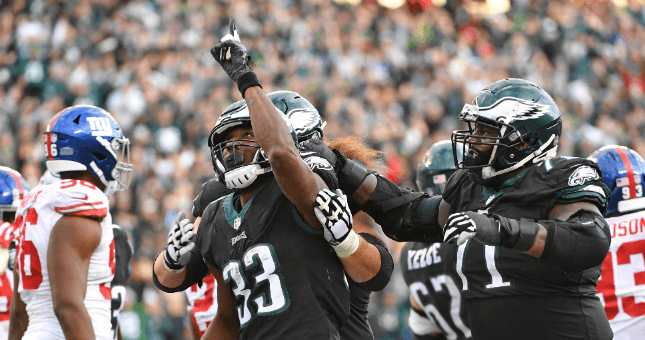 Philadelphia Eagles running back Josh Adams (33) celebrate his touchdown with offensive guard Isaac Seumalo (73) and offensive tackle Jason Peters (71).