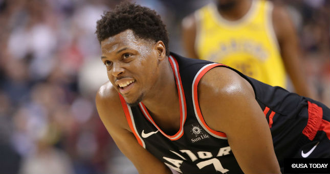 Toronto Raptors point guard Kyle Lowry (7) smiles as he looks on against the Golden State Warriors at Scotiabank Arena.