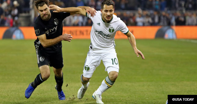 Portland Timbers midfielder Sebastian Blanco (10) and Sporting Kansas City midfielder Graham Zusi (8) fight for the ball.