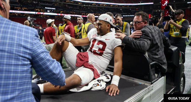 Alabama Crimson Tide quarterback Tua Tagovailoa (13) is carted off following their win over the Georgia Bulldogs 35-28 in the SEC championship game at Mercedes-Benz Stadium.