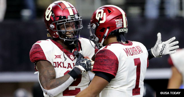 Oklahoma Sooners wide receiver CeeDee Lamb (2) and quarterback Kyler Murray (1) celebrate a touchdown during the game against the Texas Longhorns in the Big 12 Championship game at AT&T Stadium.