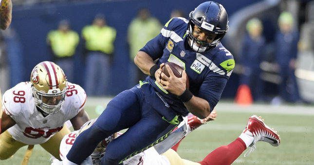 Seattle Seahawks quarterback Russell Wilson (3) is sacked by San Francisco 49ers defensive tackle DeForest Buckner (99).