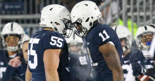 Penn State Nittany Lions linebacker Micah Parsons (11) is congratulated by defensive tackle Antonio Shelton (55).
