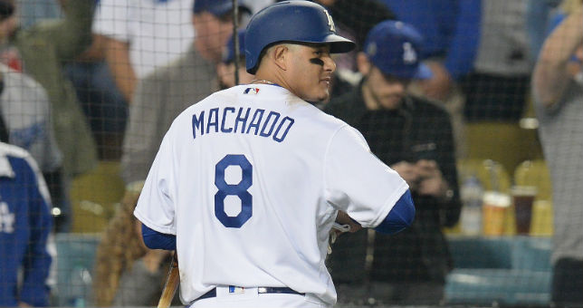 Los Angeles Dodgers shortstop Manny Machado (8) walks back to the dugout after striking out to the game against the Boston Red Sox in game five of the 2018 World Series at Dodger Stadium.