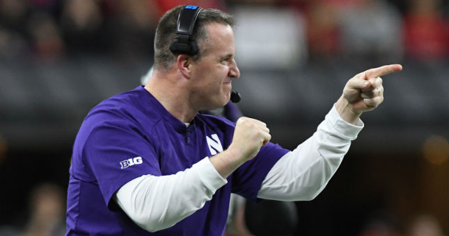 Northwestern Wildcats head coach Pat Fitzgerald reacts in the second half against the Ohio State Buckeyes the Big Ten conference championship game.