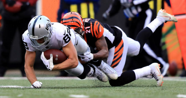 Oakland Raiders wide receiver Jordy Nelson (82) is tackled by Cincinnati Bengals defensive back Darqueze Dennard (21).