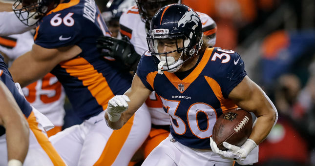 Denver Broncos running back Phillip Lindsay (30) runs the ball in the first quarter against the Cleveland Browns.