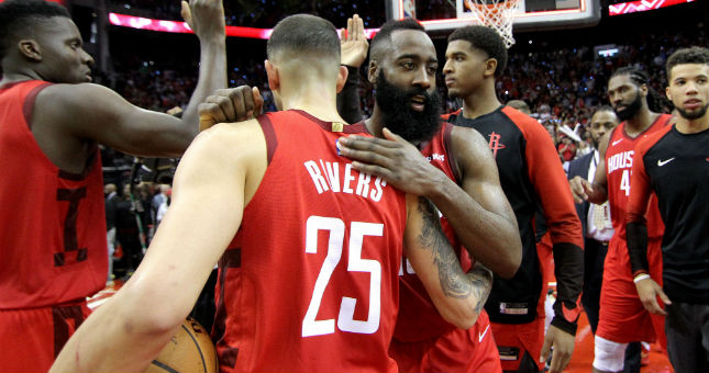Houston Rockets guard James Harden (13) is congratulated by Rockets guard Austin Rivers (25) following their 113-109 victory over the Oklahoma City Thunder.