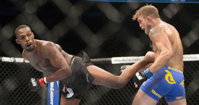 Jon Jones (left) lands a kick on Alexander Gustafsson during their World Light Heavyweight Championship bout during UFC 165 in Toronto on Saturday September 21, 2013.