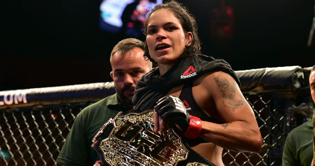 Amanda Nunes walks out of the ring after defeating Raquel Pennington (not seen) during UFC 224.