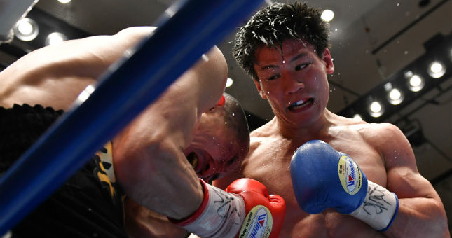 Takeshi Inoue of Japan in action against Koshinmaru Saito of Japan during the seventh round of the vacant Japanese super welterweight title bout at Korakuen Hall in Tokyo, Japan.
