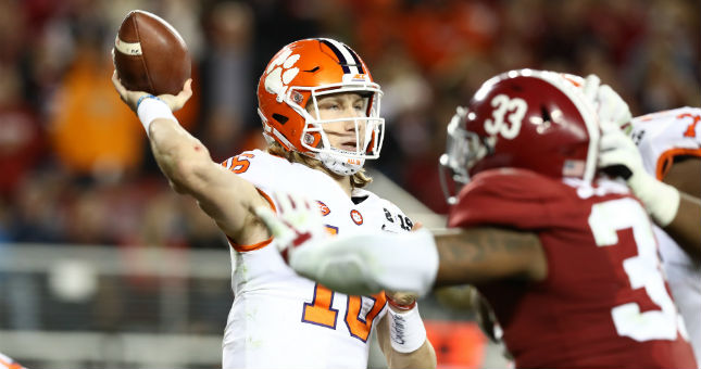 Trevor Lawrence (16) throws in the pocket against the Alabama Crimson Tide in the 2019 College Football Playoff Championship game.
