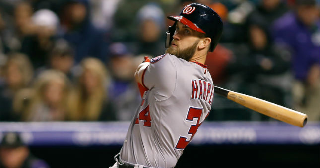 Bryce Harper bats against the Rockies last season while with the Nationals.