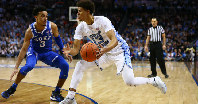 North Carolina guard Cameron Johnson (13) drives to the basket against Duke guard Tre Jones.