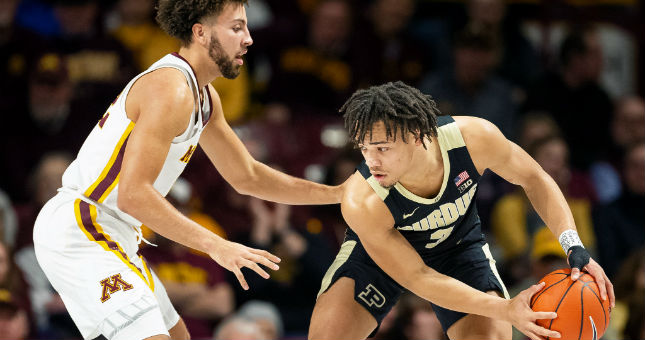 Purdue guard Carsen Edwards (3) dribbles the ball as Minnesota guard Gabe Kalscheur defends.