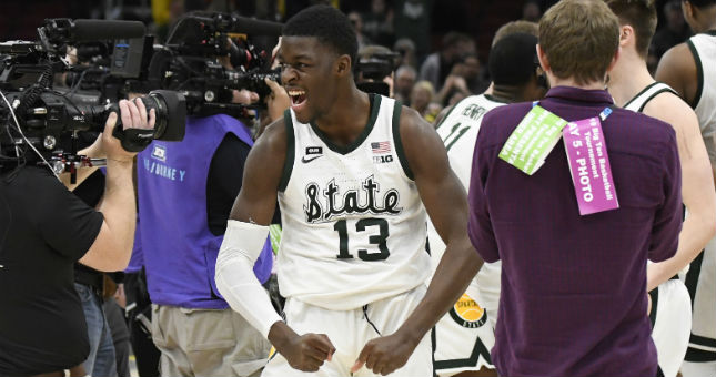 Michigan State Spartans forward Gabe Brown (13) celebrates their championship against the Michigan Wolverines.