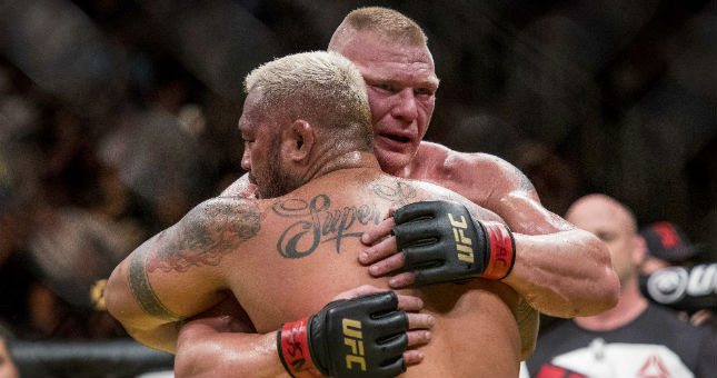 Brock Lesnar (red gloves) reacts to his win against Mark Hunt (blue gloves) during UFC 200 at T-Mobile Arena.