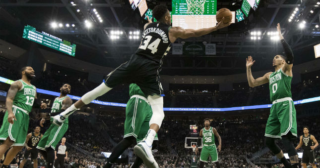 Bucks forward Giannis Antetokounmpo shoots during the third quarter against the Celtics.